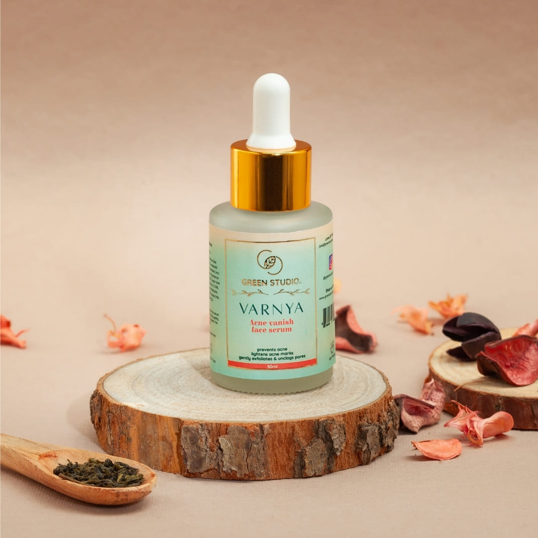 Stylized image of Avne vanish Ayurvedic serum from Green Studio Ayurveda with ingredients as props